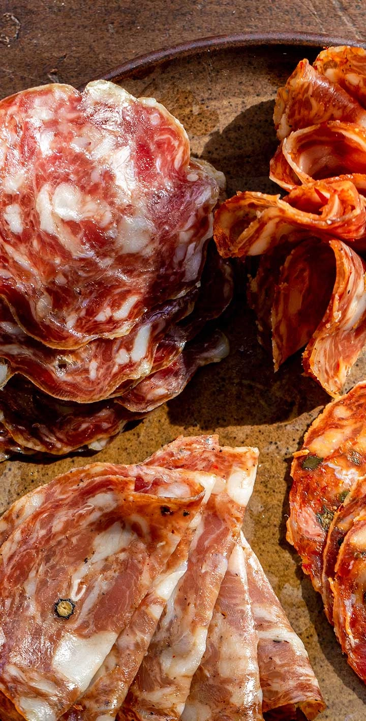 Sliced salami and cured meats